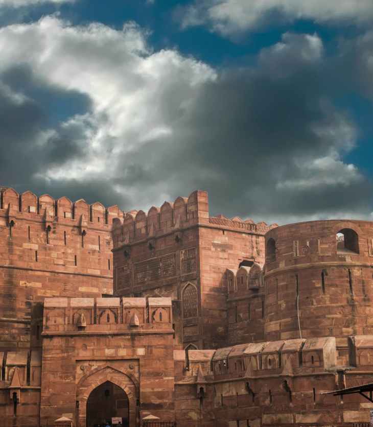 photo of castle under clouds