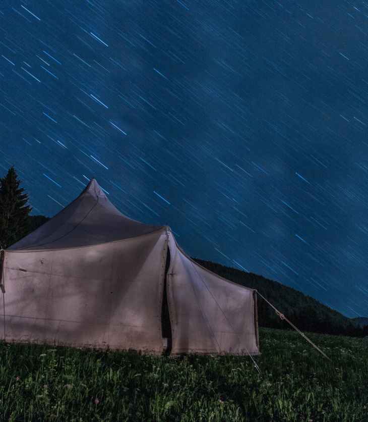 brown tent on green grass during night time
