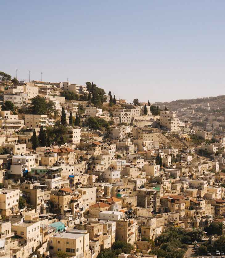 beige concrete buildings on high ground